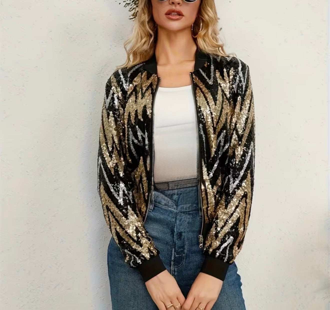sequin bomber jacket with a black, gold, and silver chevron pattern