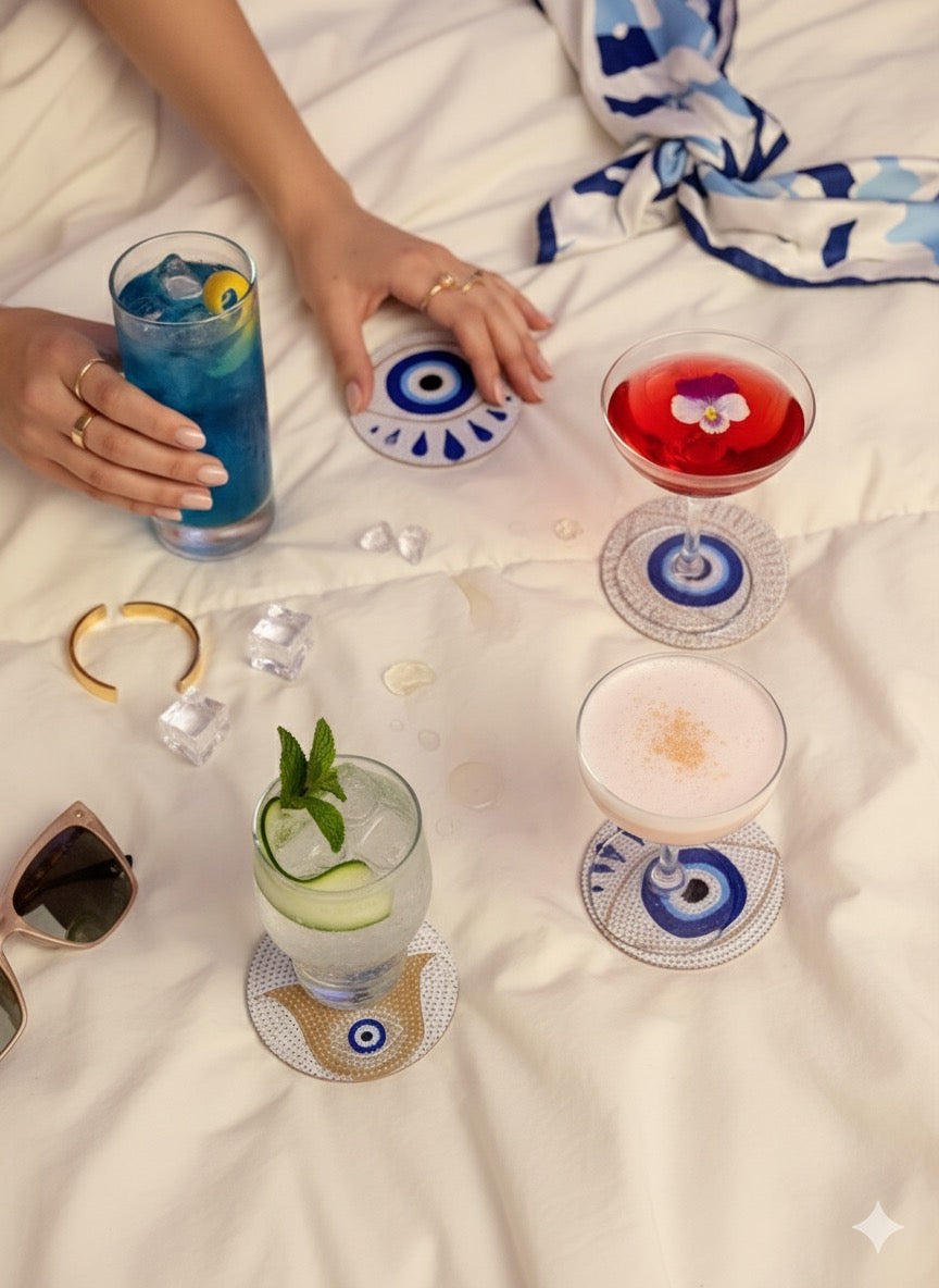 set of 4 coasters featuring the evil eye and Hamsa hand symbols